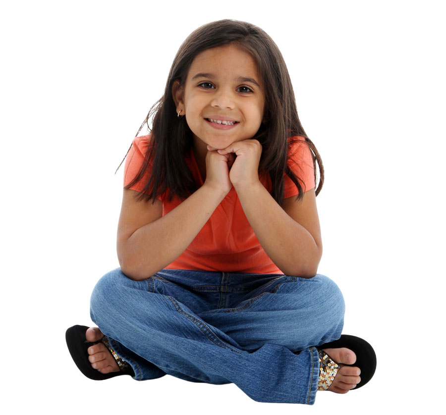 Young girl sitting and smiling Young girl sitting and smiling